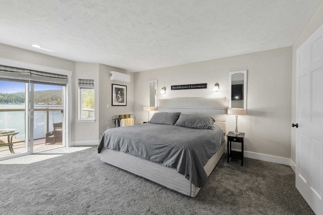12621 N E Newman Lake Dr, Newman Lake, WA 99025 - carpeted bedroom with an AC wall unit, baseboards, access to outside, and a textured ceiling