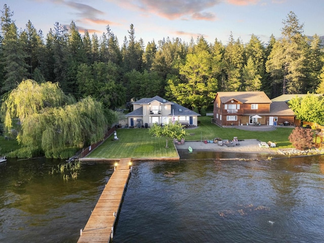 12621 N E Newman Lake Dr, Newman Lake, WA 99025 - dock area with a water view, a yard, and a view of trees