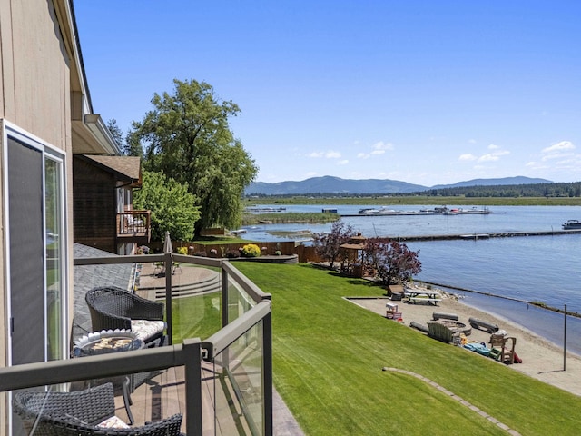 12621 N E Newman Lake Dr, Newman Lake, WA 99025 - view of grassy yard featuring a water and mountain view and a balcony