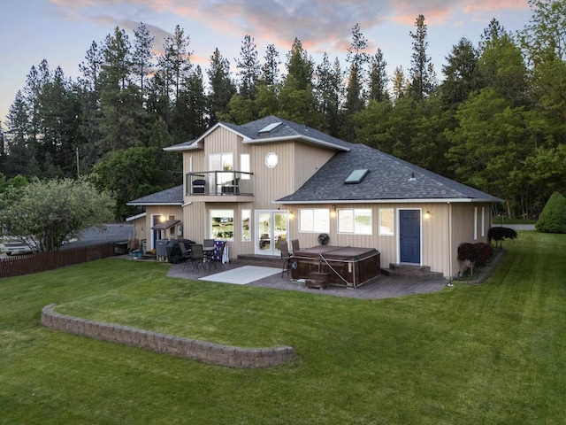 12621 N E Newman Lake Dr, Newman Lake, WA 99025 - back of property featuring a hot tub, a balcony, a patio area, a shingled roof, and entry steps