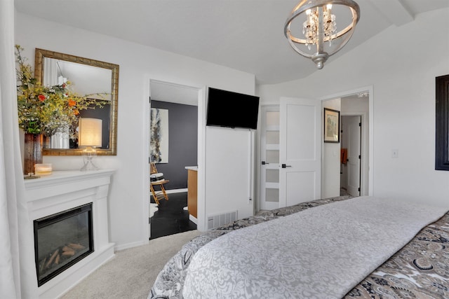 8310 E Bull Pine Ln, Spokane, WA 99217 - carpeted bedroom featuring a chandelier, a glass covered fireplace, and baseboards