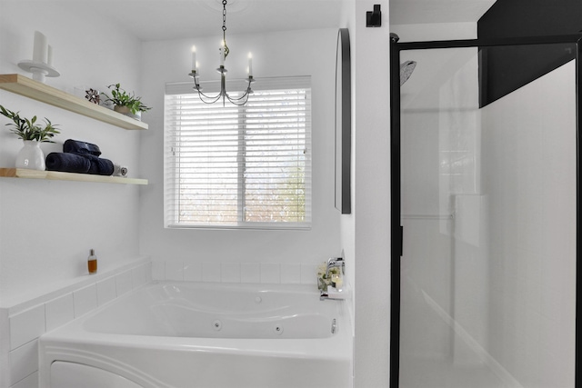 8310 E Bull Pine Ln, Spokane, WA 99217 - full bath with healthy amount of natural light, a jetted tub, a shower stall, and a chandelier