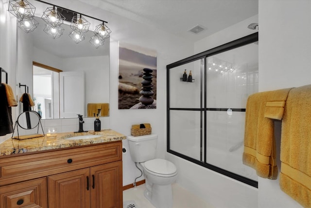 8310 E Bull Pine Ln, Spokane, WA 99217 - full bath featuring vanity, toilet, and combined bath / shower with glass door