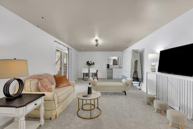 8310 E Bull Pine Ln, Spokane, WA 99217 - living room featuring carpet and arched walkways