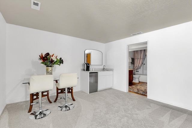 8310 E Bull Pine Ln, Spokane, WA 99217 - office space featuring a sink, light carpet, and baseboards