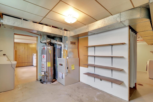 2651 E 35th Ave, Spokane, WA 99223 - unfinished below grade area with gas water heater, heating unit, and washing machine and clothes dryer
