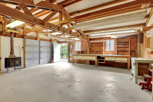 2651 E 35th Ave, Spokane, WA 99223 - garage with a workshop area and a wood stove