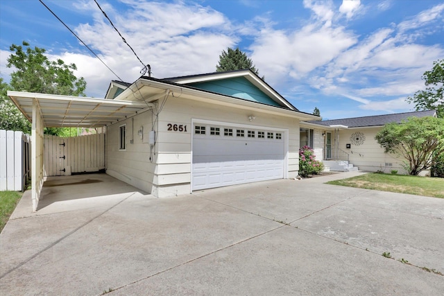 2651 E 35th Ave, Spokane, WA 99223 - single story home with concrete driveway, a carport, and a garage