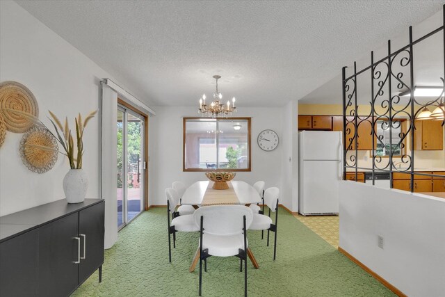 2651 E 35th Ave, Spokane, WA 99223 - dining space featuring a chandelier, baseboards, light colored carpet, and a textured ceiling