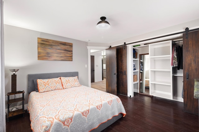 3617 N Edgerton Rd, Spokane Valley, WA 99212 - bedroom featuring a barn door and wood finished floors