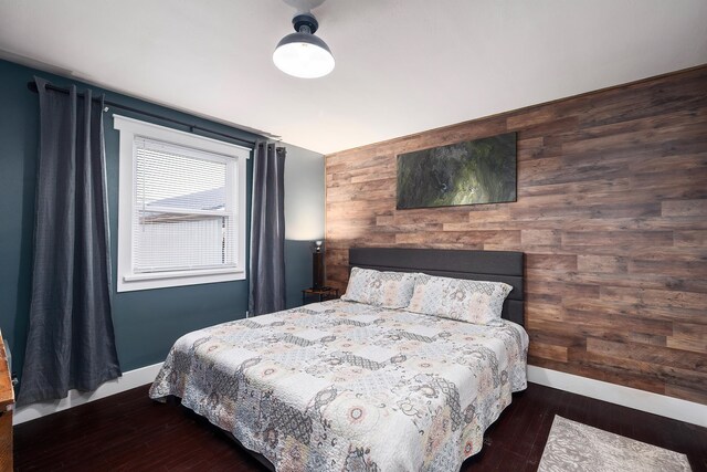 3617 N Edgerton Rd, Spokane Valley, WA 99212 - bedroom featuring baseboards, wood finished floors, and wooden walls