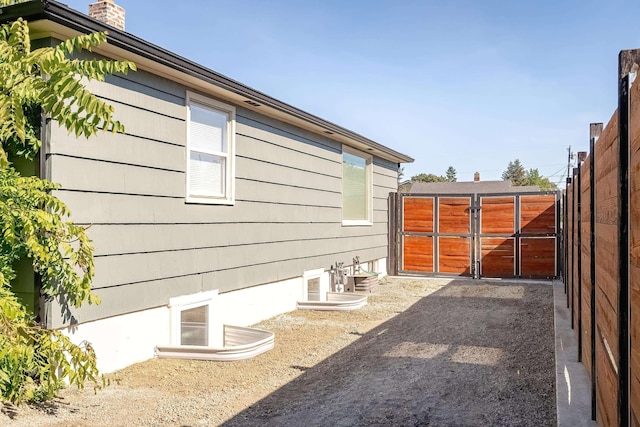 3617 N Edgerton Rd, Spokane Valley, WA 99212 - view of side of home featuring a chimney