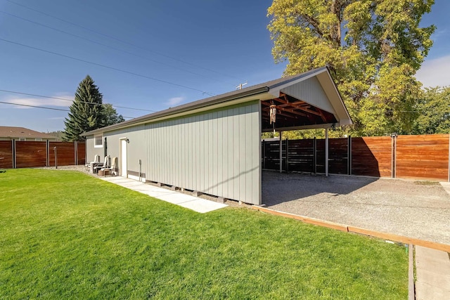3617 N Edgerton Rd, Spokane Valley, WA 99212 - view of outdoor structure featuring a carport, an exterior structure, and driveway
