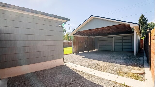 3617 N Edgerton Rd, Spokane Valley, WA 99212 - garage featuring driveway and a detached carport