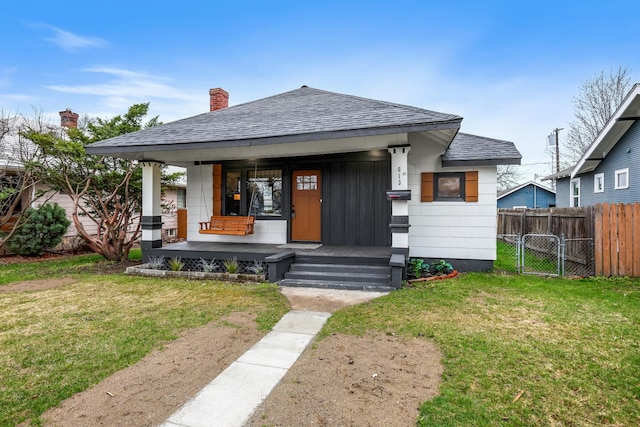 613 W Kiernan Ave, Spokane, WA 99205 - bungalow-style home featuring roof with shingles, a porch, a chimney, and a gate