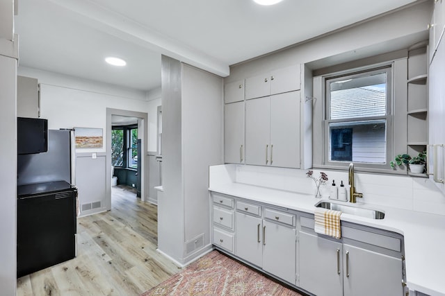613 W Kiernan Ave, Spokane, WA 99205 - kitchen with a sink, light wood finished floors, light countertops, baseboards, and recessed lighting