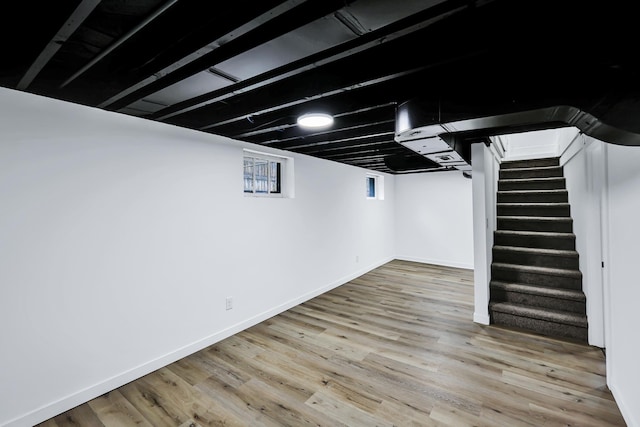 613 W Kiernan Ave, Spokane, WA 99205 - basement featuring stairs, wood finished floors, and baseboards
