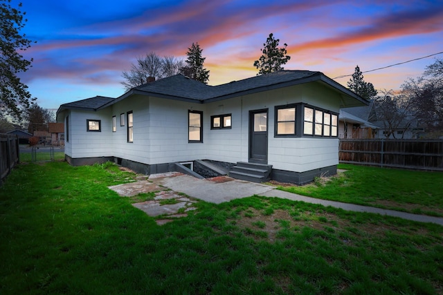 613 W Kiernan Ave, Spokane, WA 99205 - back of property at dusk with entry steps and a shingled roof