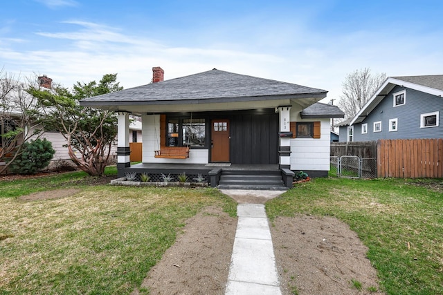 613 W Kiernan Ave, Spokane, WA 99205 - view of front facade featuring a porch, roof with shingles, and a chimney