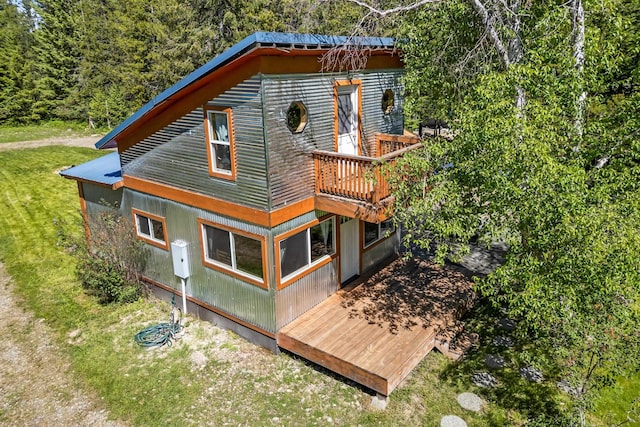1100 Graham Rd, Cusick, WA 99119 - back of property with a lawn, a wooded view, and a deck