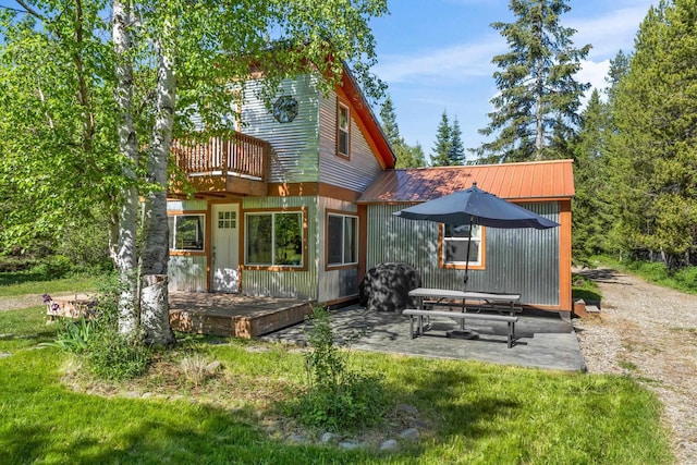 1100 Graham Rd, Cusick, WA 99119 - rear view of property with a balcony, a patio, and metal roof