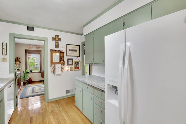 1211 W 17th Ave, Spokane, WA 99203 - kitchen with white appliances, green cabinetry, light wood finished floors, and light countertops