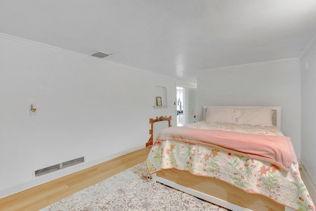 1211 W 17th Ave, Spokane, WA 99203 - bedroom with crown molding, wood finished floors, and baseboards