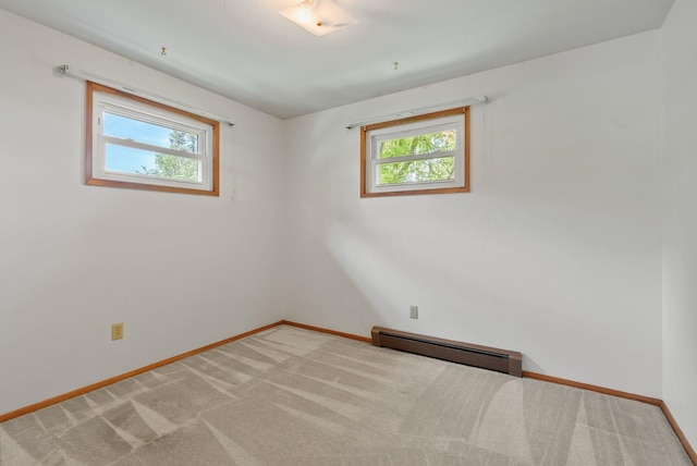 11132 S Silver Lake Rd, Medical Lake, WA 99022 - unfurnished room with baseboard heating, plenty of natural light, baseboards, and light colored carpet