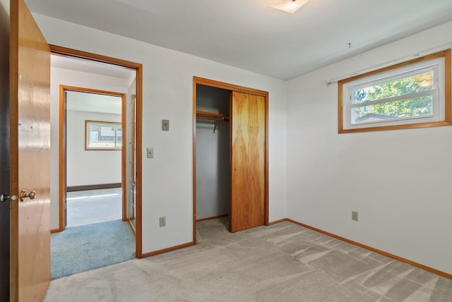11132 S Silver Lake Rd, Medical Lake, WA 99022 - unfurnished bedroom with multiple windows, light colored carpet, and baseboards