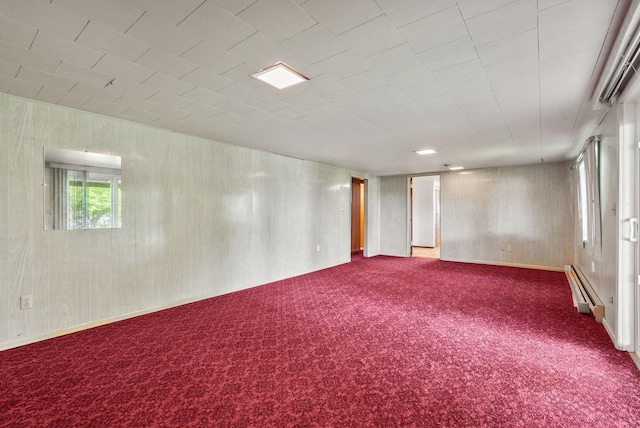 11132 S Silver Lake Rd, Medical Lake, WA 99022 - empty room featuring dark carpet, baseboard heating, and wooden walls