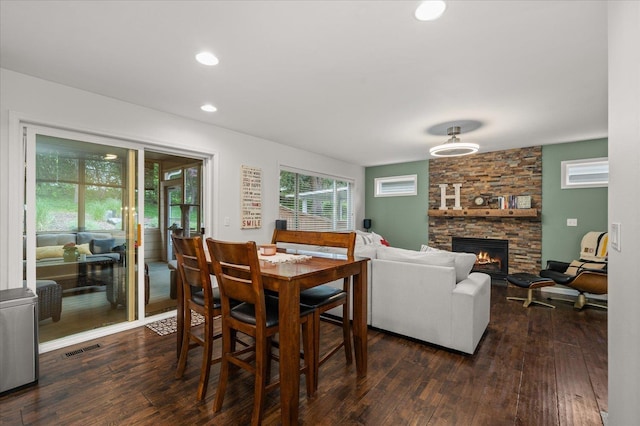 6730 S Moran View St, Spokane, WA 99224 - dining room with dark wood-type flooring, a fireplace, and recessed lighting