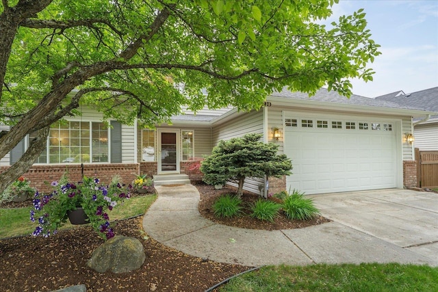 6730 S Moran View St, Spokane, WA 99224 - view of front of home with brick siding, concrete driveway, and an attached garage