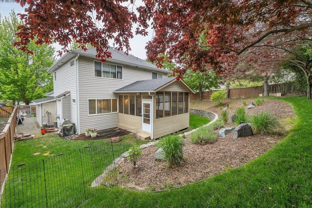6730 S Moran View St, Spokane, WA 99224 - rear view of house featuring a sunroom and a shingled roof