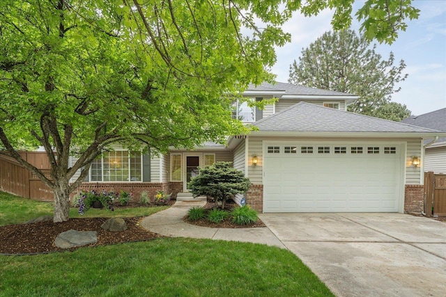 6730 S Moran View St, Spokane, WA 99224 - view of front facade featuring brick siding, an attached garage, driveway, and roof with shingles
