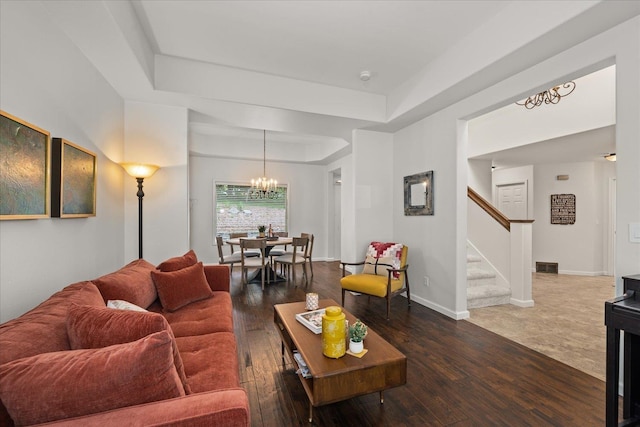 6730 S Moran View St, Spokane, WA 99224 - living room with a chandelier, stairs, a raised ceiling, and hardwood / wood-style floors
