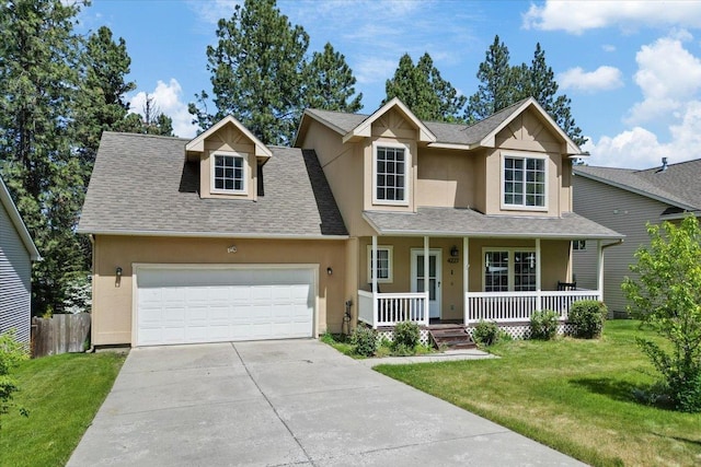 4227 E 38th Ave, Spokane, WA 99223 - traditional-style home with stucco siding, covered porch, an attached garage, and concrete driveway
