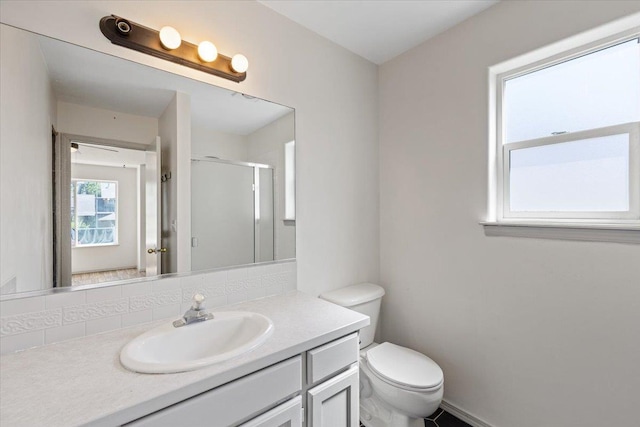4227 E 38th Ave, Spokane, WA 99223 - full bath featuring vanity, a shower stall, toilet, and baseboards