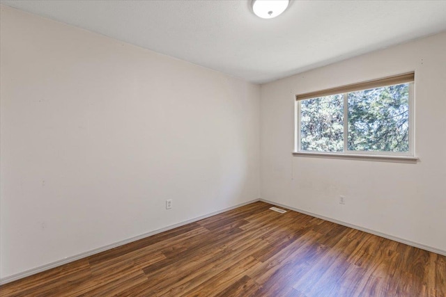 4227 E 38th Ave, Spokane, WA 99223 - spare room with wood finished floors and baseboards