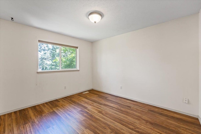 4227 E 38th Ave, Spokane, WA 99223 - empty room with wood finished floors and baseboards