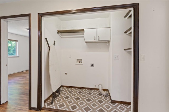4227 E 38th Ave, Spokane, WA 99223 - laundry area with gas dryer hookup, electric dryer hookup, hookup for a washing machine, baseboards, and cabinet space
