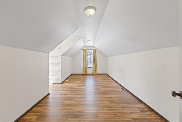 4227 E 38th Ave, Spokane, WA 99223 - bonus room featuring lofted ceiling, wood finished floors, and baseboards