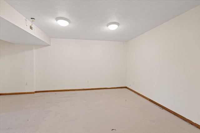 4227 E 38th Ave, Spokane, WA 99223 - spare room with baseboards and concrete floors