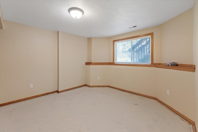 4227 E 38th Ave, Spokane, WA 99223 - empty room featuring a textured ceiling, carpet flooring, and baseboards