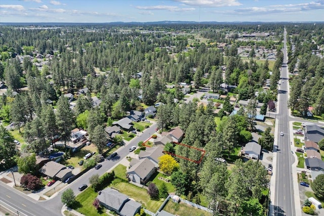 4227 E 38th Ave, Spokane, WA 99223 - aerial view of property and surrounding area with nearby suburban area and a heavily wooded area