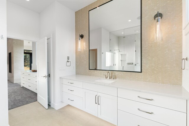 13858 N Boulder Park Ln, Spokane, WA 99208 - full bathroom with vanity, a towering ceiling, a shower, and recessed lighting