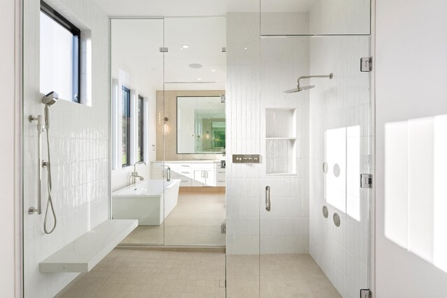 13858 N Boulder Park Ln, Spokane, WA 99208 - bathroom with a stall shower, vanity, tile walls, a freestanding bath, and tile patterned floors