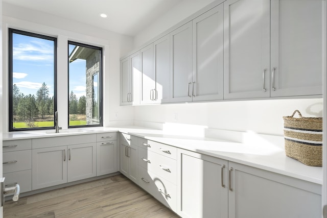 13858 N Boulder Park Ln, Spokane, WA 99208 - kitchen with a sink, light wood-style flooring, light countertops, and recessed lighting