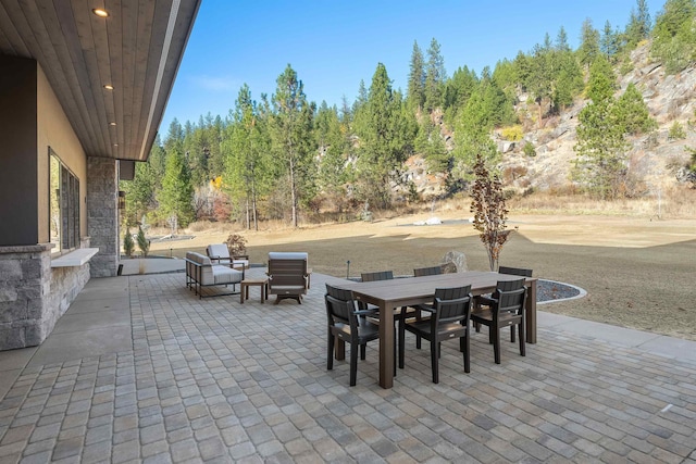 13858 N Boulder Park Ln, Spokane, WA 99208 - view of patio with outdoor dining area and view of scattered trees