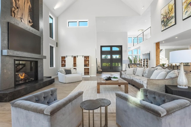 13858 N Boulder Park Ln, Spokane, WA 99208 - living room with high vaulted ceiling, wood finished floors, and a premium fireplace