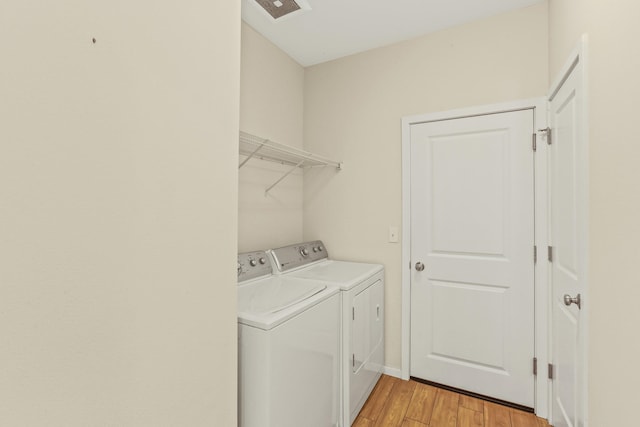 13202 N Addison St, Spokane, WA 99208 - washroom featuring independent washer and dryer and light wood finished floors